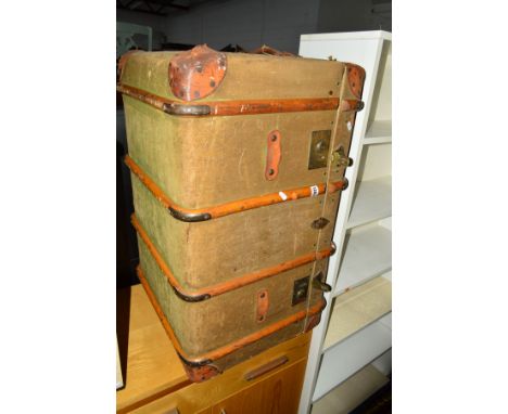A VINTAGE CANVAS WOODEN BANDED AND LEATHER BOUND TRUNK, width 84cm x depth 52cm x height 52cm