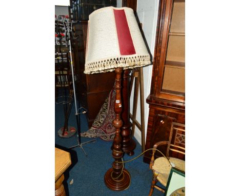 A REPRODUCTION STANDARD LAMP with a shade