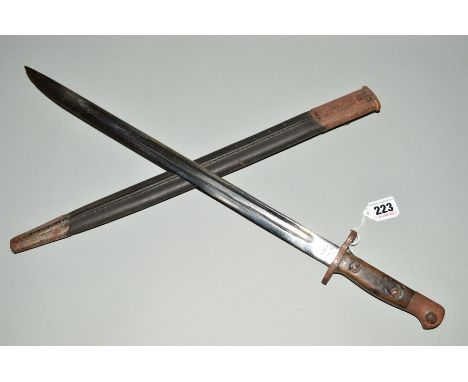 A 1907 PATTERN BAYONET AND SCABBARD for the W W 1 S.M.L.E. Rifle (short magazine lee enfield), this example is marked JAC ind