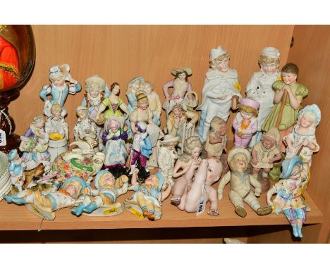 A LARGE GROUP OF BISQUE AND CERAMIC FIGURES etc, to include piano baby, pin dolly head, Continetal figural match holders, Vic