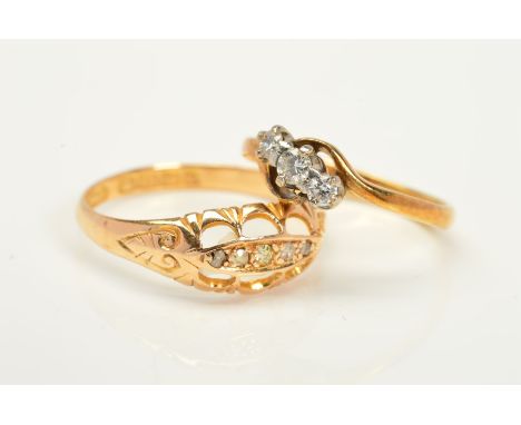 TWO DIAMOND SET RINGS, the first an Edwardian 18ct gold ring set with graduated line of five old cut diamonds in a boat shape