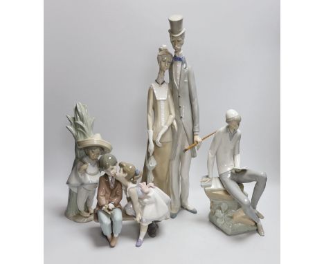 A group of four Lladro figures. Tallest 50cm