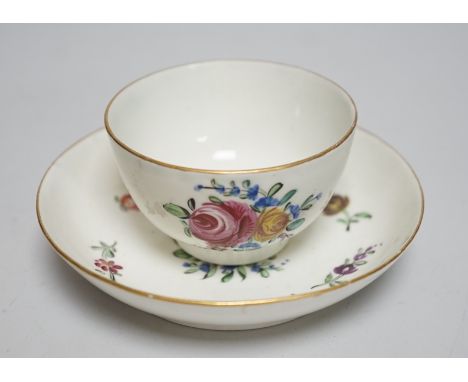 An 18th century Caughley teabowl and saucer, with back to back roses, saucer 12.5cms diameter