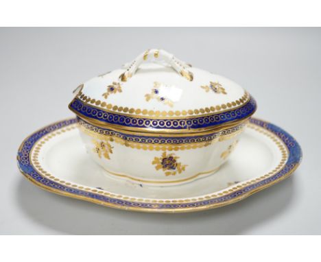 An 18th century Caughley tureen cover and stand with blue and gilt decoration, stand mis-fired to border, S mark to stand and