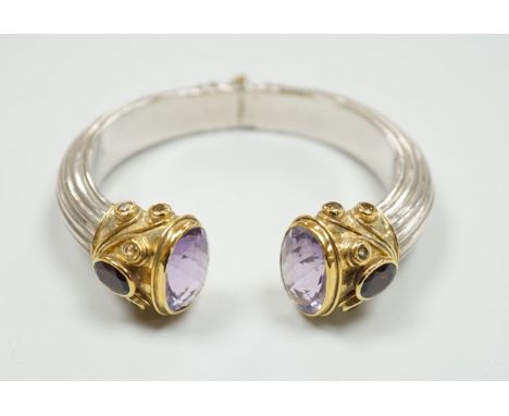 A modern parcel gilt silver amethyst and citrine set openwork spring hinged bangle.