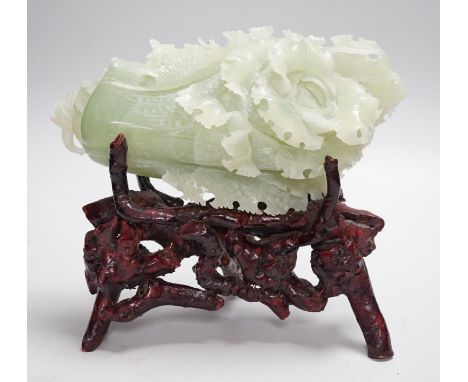 A Chinese bowenite jade carving of a cabbage and a rootwood stand, overall height 24cm