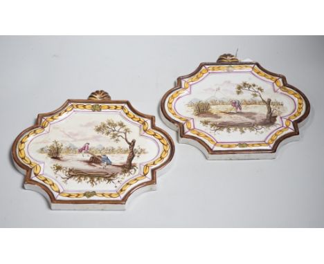 A pair of 19th century painted faience plaques in the style of Veuve Perrin 23cm