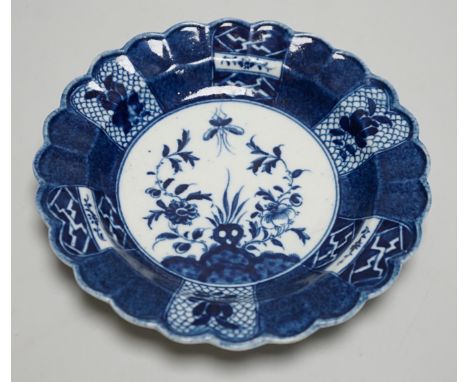An 18th century Caughley plate painted with Scholars Rock, C mark, verso, 18cms diameter