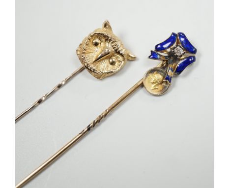 An early 20th century yellow metal enamel and diamond set ribbon bow stick pin, hung with a miniature medallion, 63mm and a l