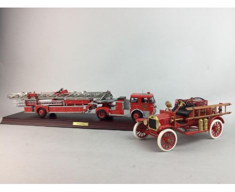 FOUR FRANKLIN MINT MODEL FIRE ENGINES, including three with associated stand