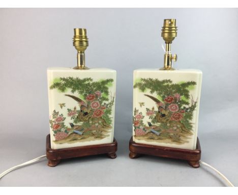 PAIR OF CERAMIC TABLE LAMPS, each depicting birds in a foliate landscape, with gilt detail, on stained wood base, 26cm high (