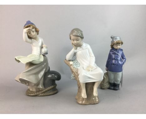 LLADRO FIGURE OF A SEATED CHILD, 21.5cm high, along with two Nao figures (3)