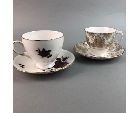 COLCLOUGH PART TEA SERVICE, with rose motif decoration, comprising five cups, six saucers, six side plates, cream and sugar, 