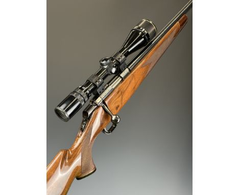 Browning Gold Medallion .22&nbsp;bolt-action rifle with gold naming, engraved decoration, chequered semi-pistol grip and fore