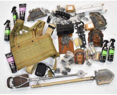 A collection of gun and shooting related items including shooting stick/ seat, military vest and belt, various penknives incl