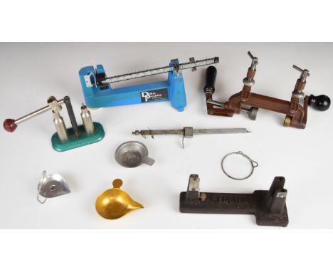 Four shotgun cartridge re-loading tools comprising Hercules 12 bore roll turnover tool, capper/ de-caper and two sets of bala