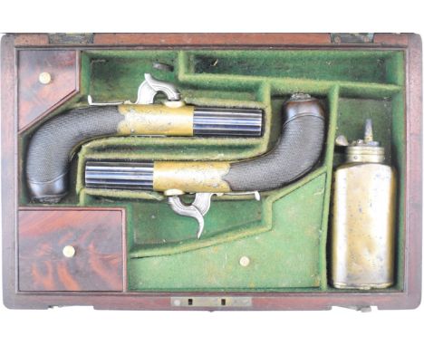 A pair of Jackson of Nottingham for Westley Richards percussion hammer action pocket pistols each with named and engraved bra