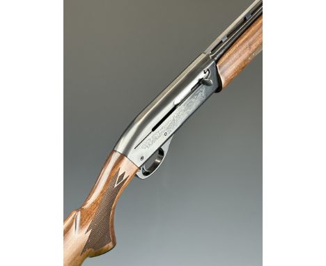 Remington Model 1100 .410 3-shot semi-automatic shotgun with ornately carved and chequered semi-pistol grip and forend, engra