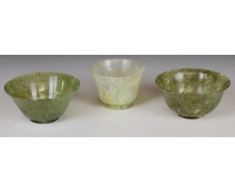 Three jade or similar hardstone pedestal dishes including a pair, largest diameter 10cm x 4.5cm