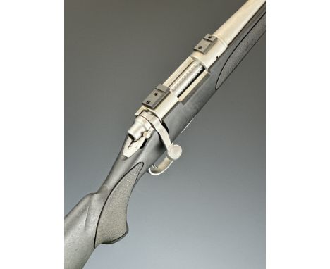 Remington Model 700 .243 Winchester bolt-action rifle with composite stock, textured semi-pistol grip and forend, sling and s