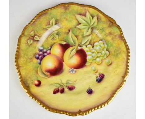 Royal Worcester painted fruit cabinet plate with gadrooned and gilded rim, signed Cox, diameter 27cm