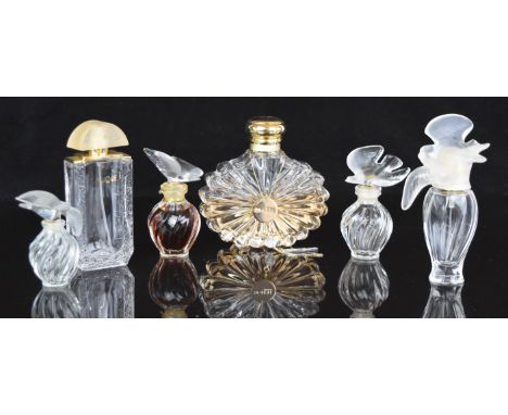 Six Lalique/ Nina Ricci glass scent bottles four with bird stoppers, all signed or with original labels to base, largest 12.5