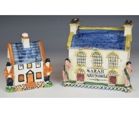 Two Prattware money boxes including an unusual large sized example inscribe Sarah Arundell, both with figural decoration, lar