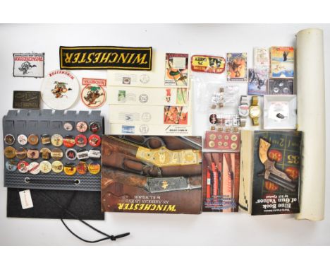 A collection of Winchester books and ephemera including Winchester An American Legend by R L Wilson, Blue Book of Gun Values 