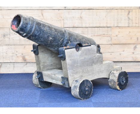 George III 12 PDR cast iron Naval cannon or carronade with 46 inch tapered barrel marked 'MMM 1809 6-0-9' below crown and wit