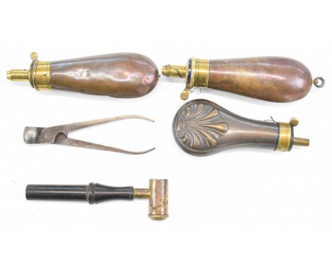Five gun related tools and accessories comprising three copper and brass powder flasks including one James Dixon &amp; Sons a
