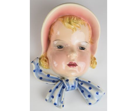 Goldscheider Art Deco wall mask plaque of a girl with bonnet, impressed and printed marks verso 7291, H23cm
