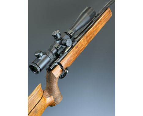 Walther .22 bolt-action target rifle with textured semi-pistol grip, adjustable butt plate, cheek piece and trigger, Fox 10-4