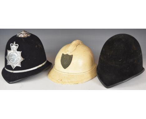 Two British police helmets, one with a Metropolitan Police Queen Elizabeth II badge the other unbadged and a Belgium Adrien h