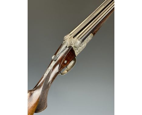 German 16 bore side by side shotgun with heavily engraved scenes of birds and rabbits to the locks, engraved underside, trigg