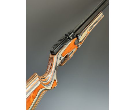 Reximex Pretensis .177 PCP air rifle with laminated show wood stock,&nbsp;semi-pistol grip,&nbsp;14 shot magazine, single sho