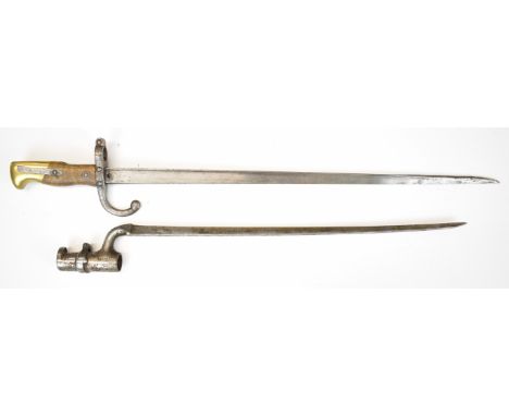 French Gras bayonet with forward swept quillon and 1880 to spine of 52cm blade, together with a socket bayonet stamped WD and