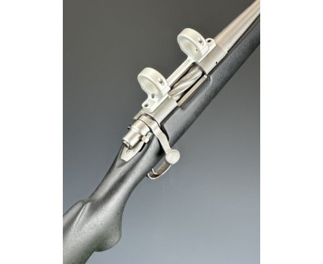 Remington Model 700 Titanium .308 Winchester bolt-action rifle with composite stock. semi-pistol grip, raised cheek piece, sc