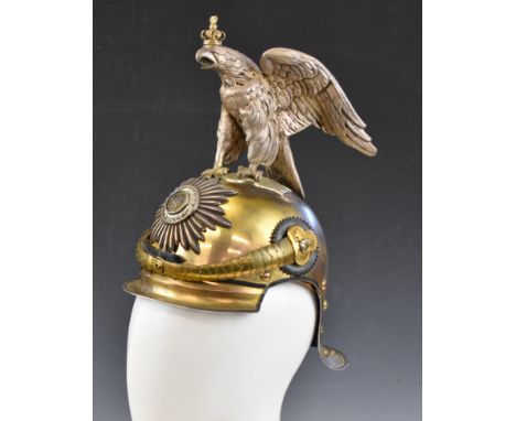 Imperial German Gardekorps helmet with crowned eagle finial, chinstrap above peak and lobster style back, the sunburst badge 