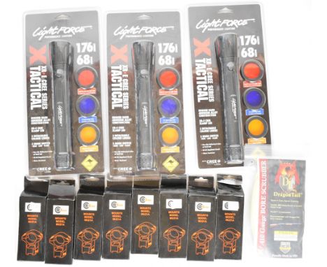 A collection of gun and shooting accessories comprising three Lightforce XR E Cree Series Tactical torches, Dragon Tail 28 bo