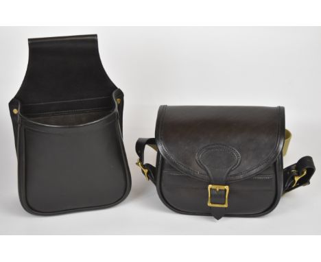 Two leather shotgun cartridge bags comprising one open carrier and one with canvas strap.&nbsp;