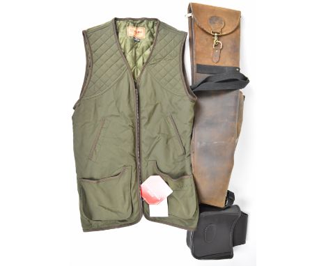 Three shooting and gun related items comprising a leather shotgun or rifle slip, leather cartridge bag and a Schoffel Gore Wi