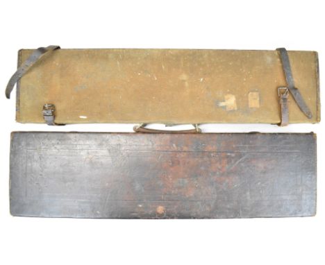 Two vintage shotgun carry cases, one leather the other canvas and leather, each approximately 83x21x8cm.&nbsp;