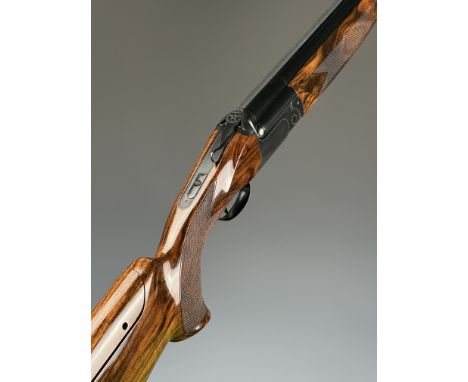 Yildiz Pro Magnum Grade IV 12 bore over and under ejector shotgun with named and border engraved locks, chequered semi-pistol