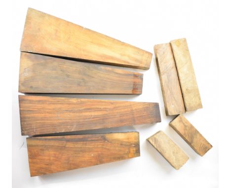Eight figured walnut shotgun or rifle stock, forend and stock extension blanks, the stock blanks largest 52cm long.&nbsp;