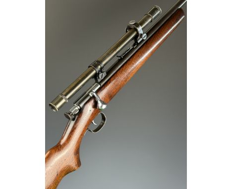 Winchester Model 67 .22 bolt-action rifle with semi-pistol grip, broad arrow to the stock, military style scope and 26 inch b