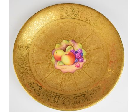 Royal Worcester painted fruit cabinet plate with heavily gilded surround, signed Shinnie, diameter 23.5cm