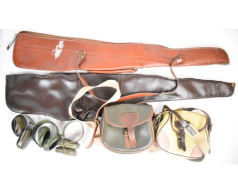 A collection of gun or shooting accessories comprising two faux leather gun slips, two shotgun cartridge bags and three pairs