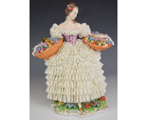 Sitzendorf figurine 'Flower Girl' with Dresden lace dress and two baskets of flowers, H26cm