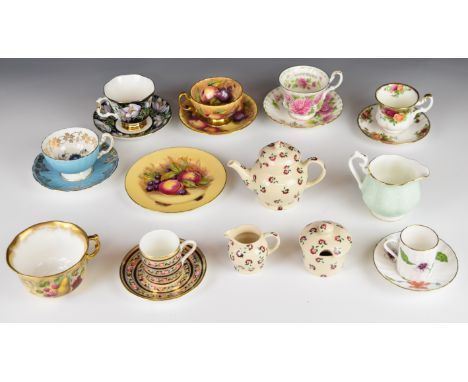 Collection of decorative teaware including Emma Bridgewater tea for one set, interior decorated tea cups and saucers by Aynsl