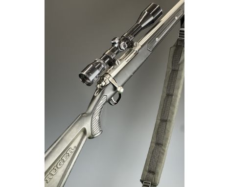 Ruger Model 77/22 .22 semi-automatic rifle with named composite stock, multi-shot magazine, padded sling, ASI 4x40 scope, sou